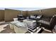 Modern rooftop patio furniture around a fire pit at 104 Alamere Falls Dr, Las Vegas, NV 89138