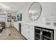 Modern wet bar with wine coolers and white cabinetry at 104 Alamere Falls Dr, Las Vegas, NV 89138