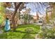 Backyard includes a swing, a treehouse, and built-in outdoor fireplace at 109 Ayesha Ln, Henderson, NV 89074