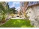 A backyard with a built-in fireplace and lush green grass at 109 Ayesha Ln, Henderson, NV 89074