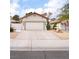 Charming single-story home with well-maintained front yard, fountain, and concrete driveway at 109 Ayesha Ln, Henderson, NV 89074