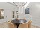 Elegant dining room with chandelier and modern table set at 11280 Granite Ridge Dr # 1044, Las Vegas, NV 89135