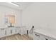 Bright laundry room with white cabinets and quartz countertops at 11280 Granite Ridge Dr # 1044, Las Vegas, NV 89135