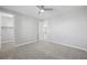 Well-lit bedroom featuring a walk-in closet and carpet flooring at 11857 Corenzio Ave, Las Vegas, NV 89138