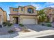 Two-story house with beige siding, gray shutters, and a brick walkway at 11857 Corenzio Ave, Las Vegas, NV 89138