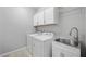 Laundry room with washer, dryer, and utility sink at 11857 Corenzio Ave, Las Vegas, NV 89138