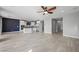 Open living room with tile floors and access to the kitchen at 11857 Corenzio Ave, Las Vegas, NV 89138