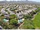 Aerial view of a residential neighborhood with houses featuring solar panels and pools at 1327 Coulisse St, Henderson, NV 89052