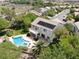 Aerial view of house with pool and solar panels, nestled in a residential neighborhood at 1327 Coulisse St, Henderson, NV 89052