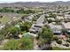 Aerial view showcasing a house with a pool, solar panels and a basketball court nearby at 1327 Coulisse St, Henderson, NV 89052