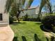 Expansive grassy backyard with a swing set and mature trees at 1327 Coulisse St, Henderson, NV 89052