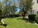 Level grassy backyard with a playset, perfect for children at 1327 Coulisse St, Henderson, NV 89052