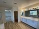 Double vanity bathroom with modern cabinets and lighting at 1327 Coulisse St, Henderson, NV 89052