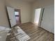 Bright bedroom with wood flooring and access to other rooms at 1327 Coulisse St, Henderson, NV 89052