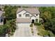 Two-story house with a double garage, landscaping, and a walkway at 1327 Coulisse St, Henderson, NV 89052