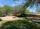 Landscaped backyard with a firepit and seating area at 1327 Coulisse St, Henderson, NV 89052