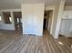 Light and airy hallway with light wood flooring at 1327 Coulisse St, Henderson, NV 89052