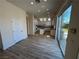 Kitchen with white cabinets, granite counters and island at 1327 Coulisse St, Henderson, NV 89052