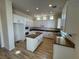 Bright kitchen with white cabinets and granite island at 1327 Coulisse St, Henderson, NV 89052