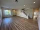 Bright and airy living room with hardwood floors and a staircase at 1327 Coulisse St, Henderson, NV 89052