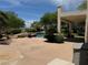 Relaxing pool area with spacious patio and surrounding greenery at 1327 Coulisse St, Henderson, NV 89052