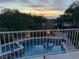 Stunning pool and patio with mountain views at sunset at 1327 Coulisse St, Henderson, NV 89052