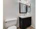 A simple bathroom with tiled countertop and floors, featuring a commode at 1600 N Torrey Pines Dr # 202, Las Vegas, NV 89108