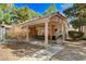 Covered patio with seating, grill, and tiled roof is ready for outdoor gatherings at 1600 N Torrey Pines Dr # 202, Las Vegas, NV 89108