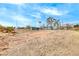 Large backyard with mostly dirt and sparse vegetation at 1620 Leonard Ln, Las Vegas, NV 89108