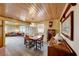 Spacious dining area with vintage furniture and wood floors at 1620 Leonard Ln, Las Vegas, NV 89108