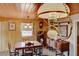 Bright dining room with vintage wooden furniture and light walls at 1620 Leonard Ln, Las Vegas, NV 89108