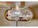 View through partition shows a vintage kitchen with white cabinets at 1620 Leonard Ln, Las Vegas, NV 89108