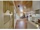 Open kitchen layout with white cabinets and wood flooring at 1620 Leonard Ln, Las Vegas, NV 89108