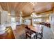 Open concept kitchen and dining area with wood accents at 1620 Leonard Ln, Las Vegas, NV 89108