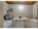 Laundry room with washer, dryer, and built-in cabinets at 1620 Leonard Ln, Las Vegas, NV 89108