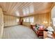 Bright living room featuring wood paneled walls and ample natural light at 1620 Leonard Ln, Las Vegas, NV 89108