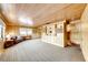 Spacious living room with wood paneled walls and built-in shelving at 1620 Leonard Ln, Las Vegas, NV 89108