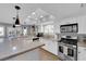 Modern kitchen with stainless steel appliances and an island at 1837 Birdie Ln, Henderson, NV 89074