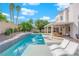 Inviting swimming pool with a spacious patio and pergola at 1837 Birdie Ln, Henderson, NV 89074