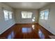 Living room with hardwood floors and large windows at 1944 Las Palmas Ln # 175, Laughlin, NV 89029