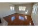 Hardwood floor living room with multiple windows at 1944 Las Palmas Ln # 175, Laughlin, NV 89029