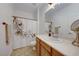 Clean bathroom with wood vanity, shower, and decorative curtain at 2090 Lewiston Pl, Henderson, NV 89044