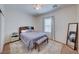 Bright bedroom with a queen bed, carpet, and window coverings at 2090 Lewiston Pl, Henderson, NV 89044