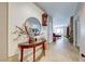 Bright entryway with a console table, mirror, and elegant wall decor at 2090 Lewiston Pl, Henderson, NV 89044