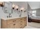 Modern bathroom with double sinks, and a view of the bedroom at 2153 Eaglecloud Dr, Henderson, NV 89074