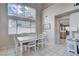 Bright dining room with a view into the kitchen at 2153 Eaglecloud Dr, Henderson, NV 89074