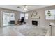 Gathering room features fireplace, ceiling fan and sliding door to patio at 2153 Eaglecloud Dr, Henderson, NV 89074