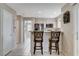 Kitchen with breakfast bar, stainless steel appliances and light wood cabinets at 2153 Eaglecloud Dr, Henderson, NV 89074