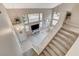 High ceiling living room with stairs, TV and lots of natural light at 2153 Eaglecloud Dr, Henderson, NV 89074