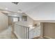 Upstairs hallway with view of living room and open floorplan at 2153 Eaglecloud Dr, Henderson, NV 89074